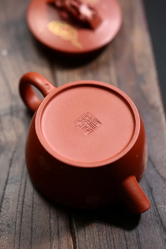 Yixing Zisha Teapot - Handcrafted Purple Clay Pot with Golden Patterns 1